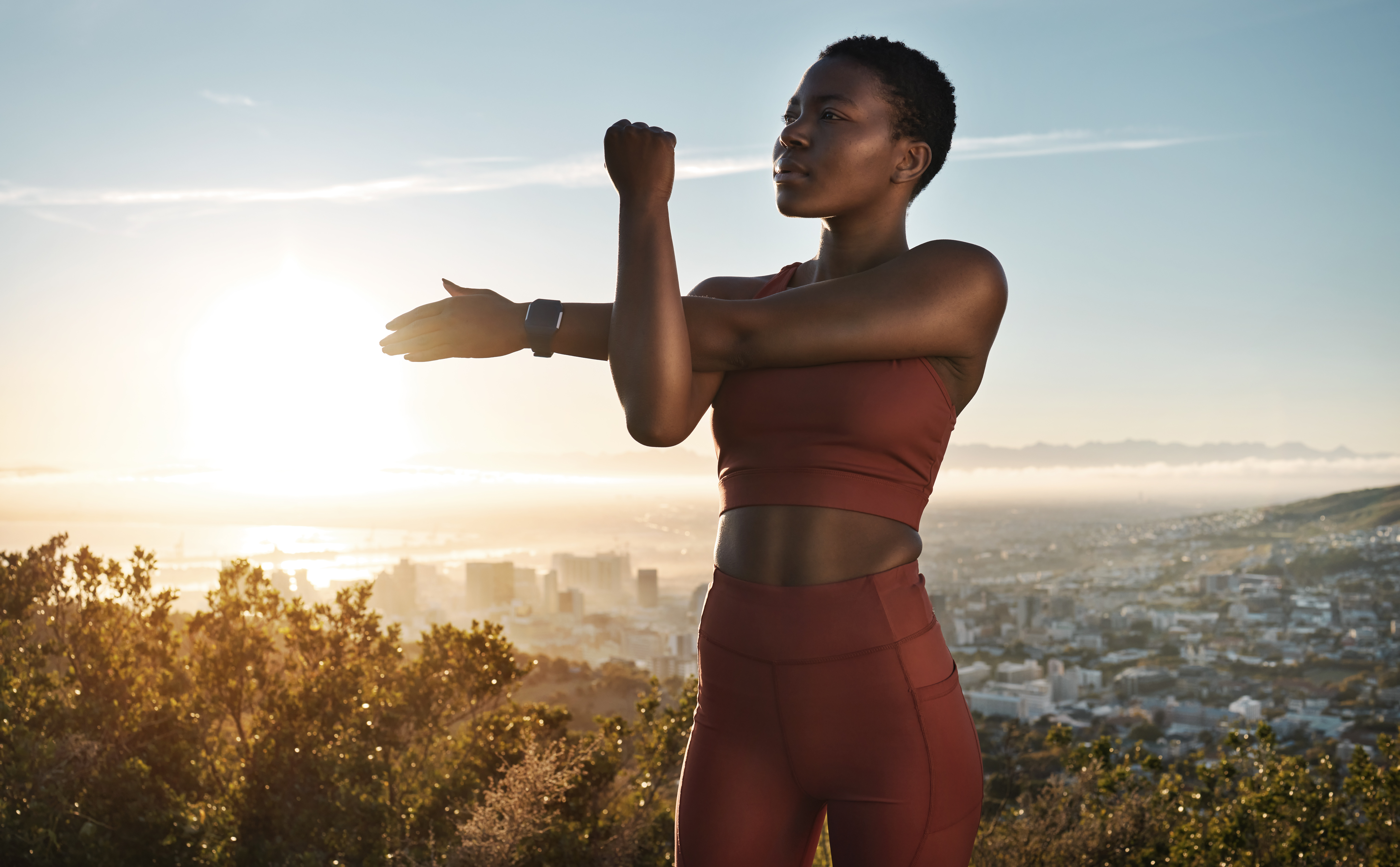 Fit woman stretching outdoors